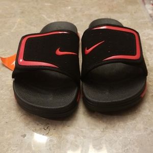 Black and red Nike slides